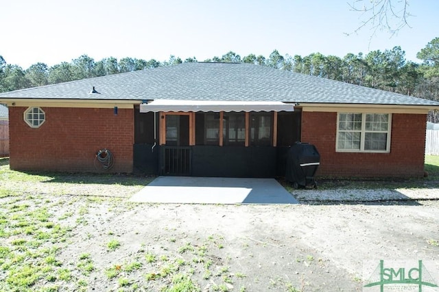 350 Clark St, Richmond Hill, GA 31324 - back of house with a patio area, brick siding, and roof with shingles