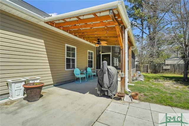 view of patio featuring ceiling fan and a fenced backyard