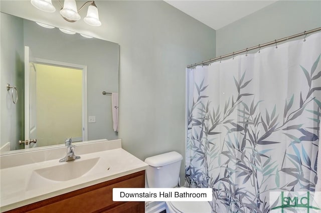 full bath with toilet and vanity