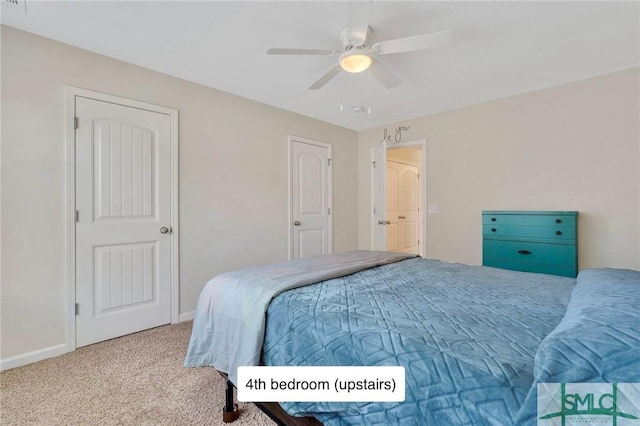 carpeted bedroom with baseboards and ceiling fan