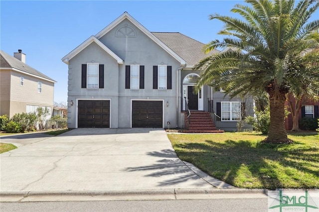 141 Runner Rd, Savannah, GA 31410 - view of front of home featuring stucco siding, a garage, driveway, and a front yard