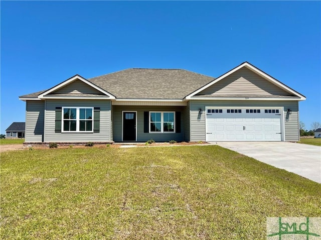 view of front of property with a front yard, concrete driveway, a garage, and roof with shingles