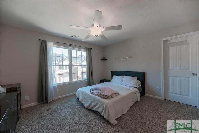 30 Walker Ct, Richmond Hill, GA 31324 - bedroom featuring light colored carpet, visible vents, ceiling fan, and baseboards