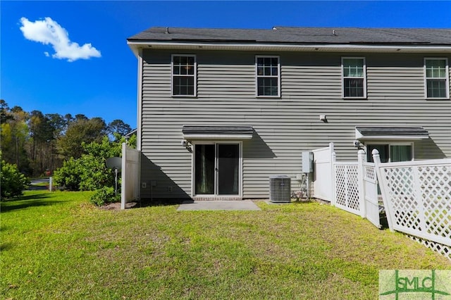 30 Walker Ct, Richmond Hill, GA 31324 - back of house with central air condition unit and a yard