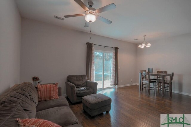30 Walker Ct, Richmond Hill, GA 31324 - living area with baseboards, visible vents, ceiling fan with notable chandelier, and wood finished floors