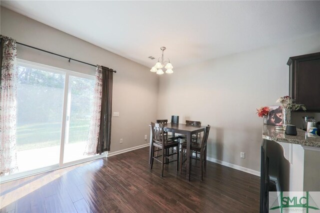 30 Walker Ct, Richmond Hill, GA 31324 - dining room with baseboards, a notable chandelier, and dark wood finished floors