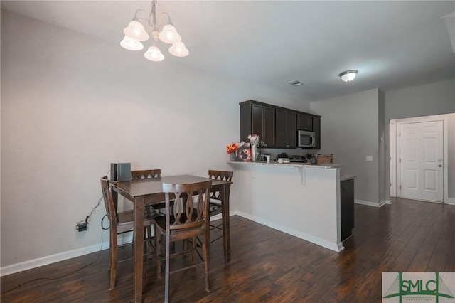 30 Walker Ct, Richmond Hill, GA 31324 - dining room featuring visible vents, a notable chandelier, baseboards, and dark wood finished floors
