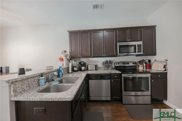 30 Walker Ct, Richmond Hill, GA 31324 - kitchen with a sink, visible vents, appliances with stainless steel finishes, and dark brown cabinets