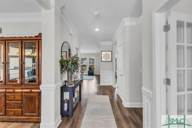 52 Shoefstall St, Port Wentworth, GA 31407 - hallway featuring dark wood-style flooring, a decorative wall, crown molding, recessed lighting, and wainscoting