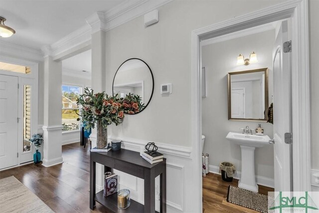 52 Shoefstall St, Port Wentworth, GA 31407 - foyer entrance featuring baseboards, decorative columns, crown molding, and wood finished floors