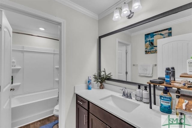 52 Shoefstall St, Port Wentworth, GA 31407 - full bath with crown molding, toilet, vanity, shower / washtub combination, and wood finished floors