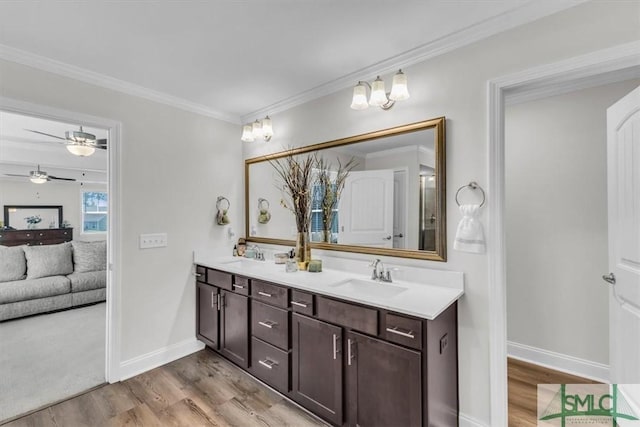 52 Shoefstall St, Port Wentworth, GA 31407 - bathroom with ceiling fan, a sink, crown molding, and wood finished floors