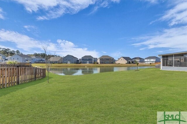 52 Shoefstall St, Port Wentworth, GA 31407 - view of yard featuring a residential view, a sunroom, a water view, and fence