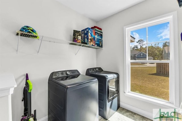 52 Shoefstall St, Port Wentworth, GA 31407 - laundry room featuring baseboards, washing machine and clothes dryer, laundry area, and a healthy amount of sunlight