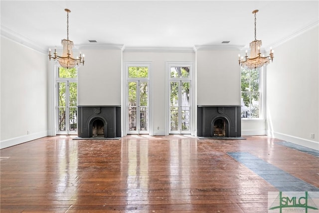 417 Whitaker St, Savannah, GA 31401 - unfurnished living room featuring a chandelier, a fireplace with raised hearth, healthy amount of natural light, and crown molding
