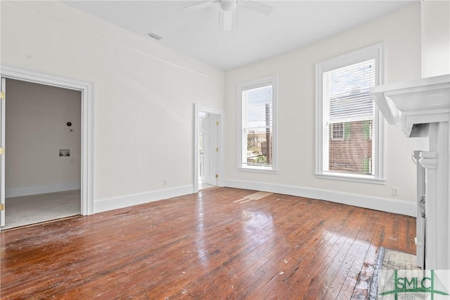 417 Whitaker St, Savannah, GA 31401 - unfurnished living room with ceiling fan, wood-type flooring, and baseboards