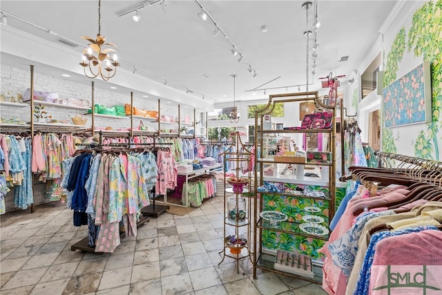 417 Whitaker St, Savannah, GA 31401 - miscellaneous room featuring a chandelier and rail lighting