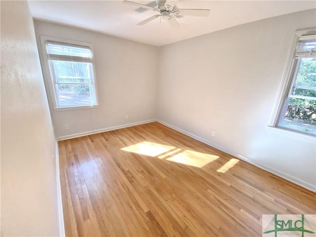 unfurnished room featuring baseboards, ceiling fan, and light wood-style floors