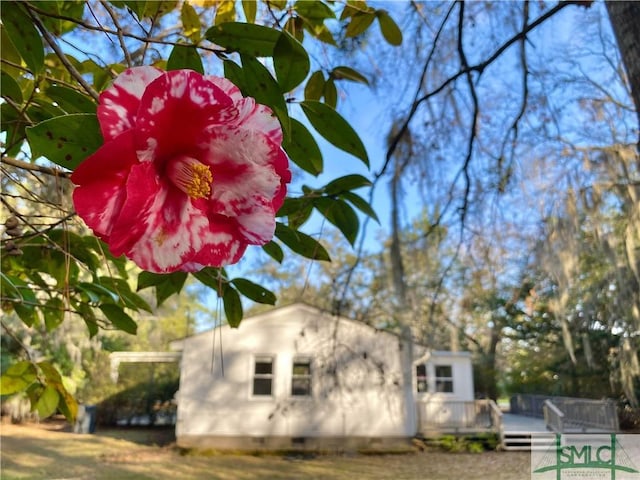 22 Colonel Estill Ave, Savannah, GA 31406 - view of side of home with crawl space and a wooden deck