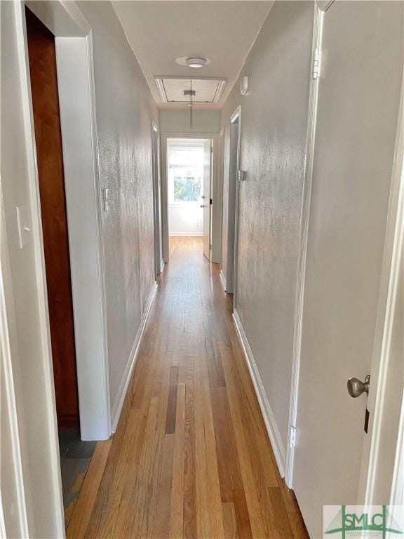 22 Colonel Estill Ave, Savannah, GA 31406 - hallway with attic access, light wood-type flooring, and baseboards