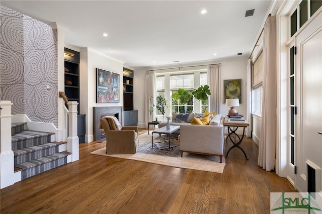 5091/2 Tattnall St, Savannah, GA 31401 - living area featuring crown molding, stairway, wood finished floors, and recessed lighting
