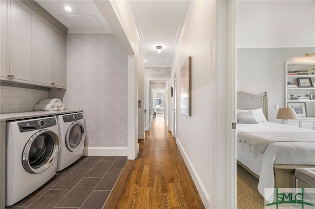 5091/2 Tattnall St, Savannah, GA 31401 - washroom with cabinet space, washing machine and dryer, baseboards, and dark wood finished floors
