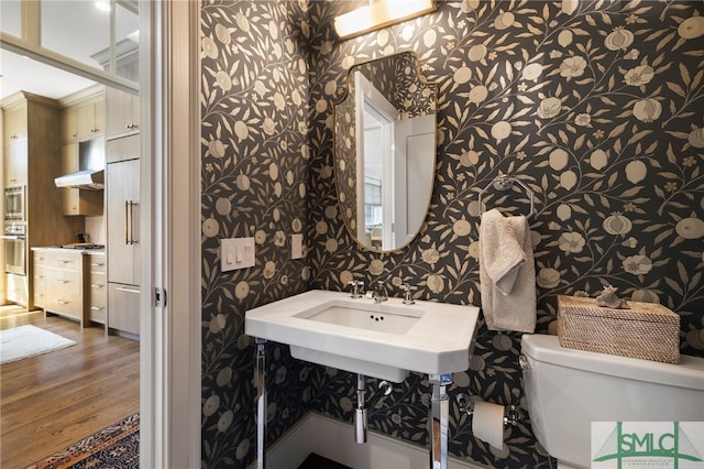 5091/2 Tattnall St, Savannah, GA 31401 - bathroom featuring wallpapered walls, toilet, and wood finished floors