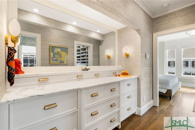 5091/2 Tattnall St, Savannah, GA 31401 - bathroom with vanity, recessed lighting, ornamental molding, baseboards, and wood finished floors