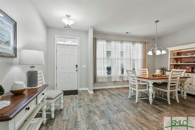 95 Glen Way, Richmond Hill, GA 31324 - entrance foyer with wood finished floors, a chandelier, and baseboards