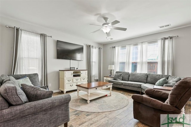 95 Glen Way, Richmond Hill, GA 31324 - living area featuring wood finished floors, a ceiling fan, and baseboards