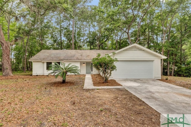 single story home with an attached garage and concrete driveway