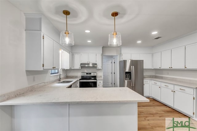 kitchen featuring under cabinet range hood, appliances with stainless steel finishes, a sink, and recessed lighting