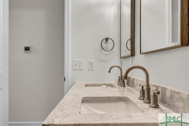 interior details featuring a sink and double vanity