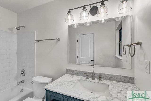 full bath with shower / bathtub combination, vanity, and toilet