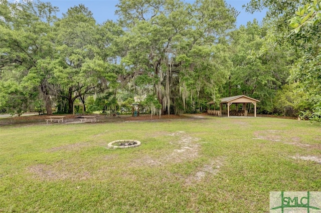 view of yard with a fire pit and a gazebo