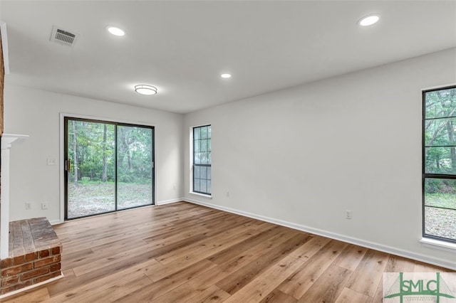 unfurnished living room with recessed lighting, baseboards, visible vents, and light wood-style flooring