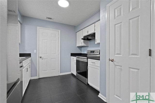 210 Mulberry Way, Rincon, GA 31326 - kitchen featuring stainless steel electric range, under cabinet range hood, white cabinetry, dark countertops, and dark tile patterned flooring