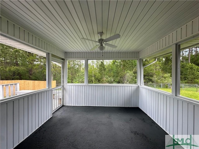 210 Mulberry Way, Rincon, GA 31326 - unfurnished sunroom featuring a ceiling fan, view of scattered trees, and plenty of natural light