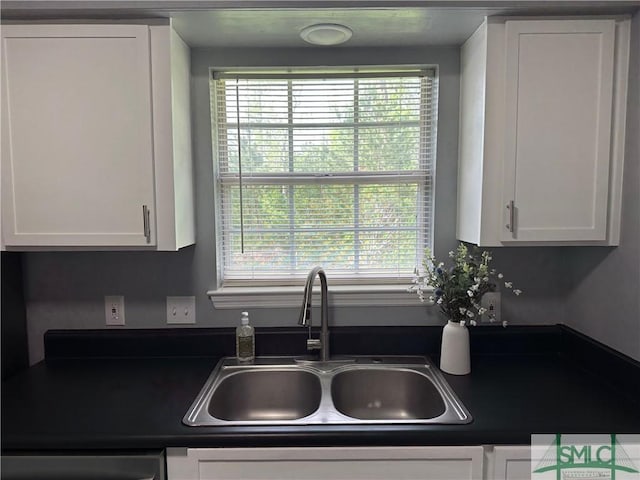 210 Mulberry Way, Rincon, GA 31326 - kitchen with a sink, dark countertops, white cabinets, and healthy amount of natural light