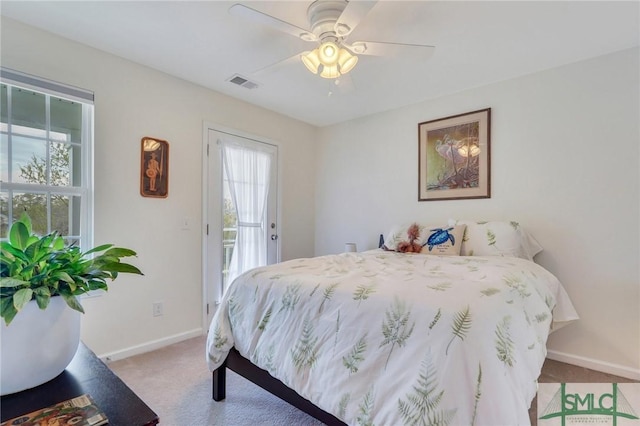 3286 Garden Hills Loop, Richmond Hill, GA 31324 - bedroom featuring light carpet, access to exterior, baseboards, visible vents, and a ceiling fan