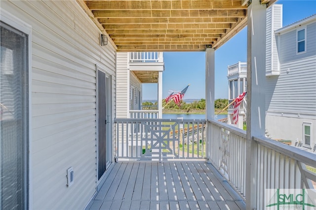 deck featuring a water view