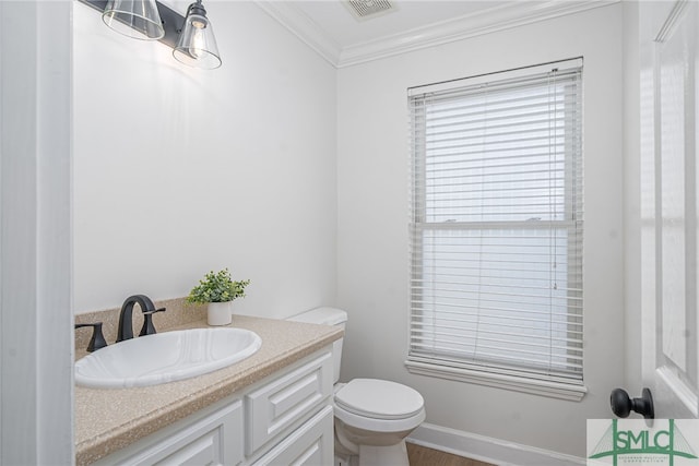 bathroom featuring vanity, visible vents, ornamental molding, and toilet