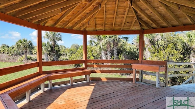 wooden terrace featuring a gazebo