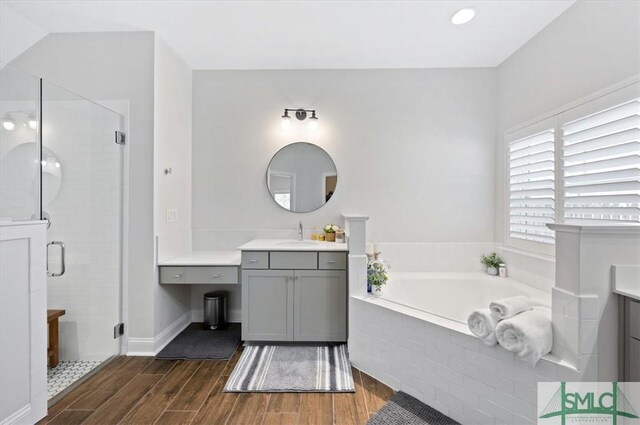 82 Rimmon Ct, Richmond Hill, GA 31324 - full bath featuring vanity, a shower stall, and wood finished floors