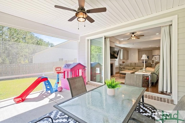 82 Rimmon Ct, Richmond Hill, GA 31324 - view of patio / terrace with a ceiling fan, outdoor dining area, and fence