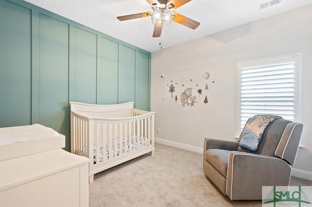 82 Rimmon Ct, Richmond Hill, GA 31324 - bedroom with light carpet, baseboards, visible vents, and a nursery area