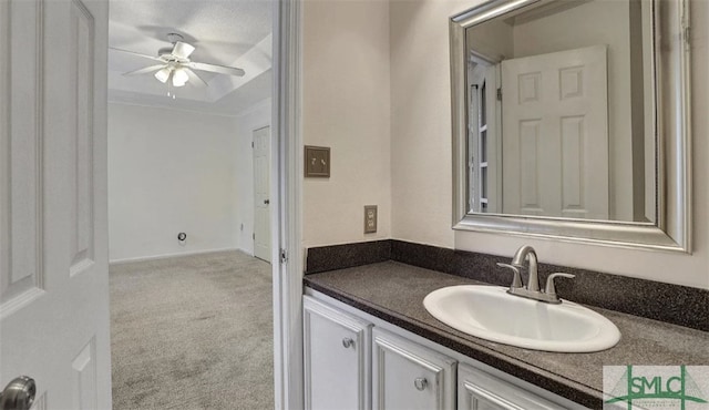 bathroom with ceiling fan and vanity