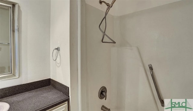 bathroom with vanity and shower / washtub combination