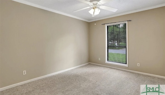 carpeted empty room featuring baseboards, a textured ceiling, ornamental molding, and ceiling fan
