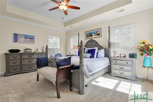 93 Bradford Pear Dr, Richmond Hill, GA 31324 - bedroom with a tray ceiling, multiple windows, light colored carpet, baseboards, and ornamental molding